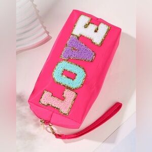 NWT LOVE makeup/wristlet makeup bag. Hot pink with Patch letters!